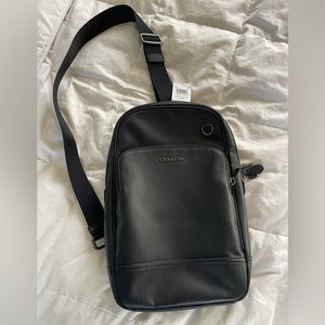 New with tags Coach Graham sling backpack in black leather